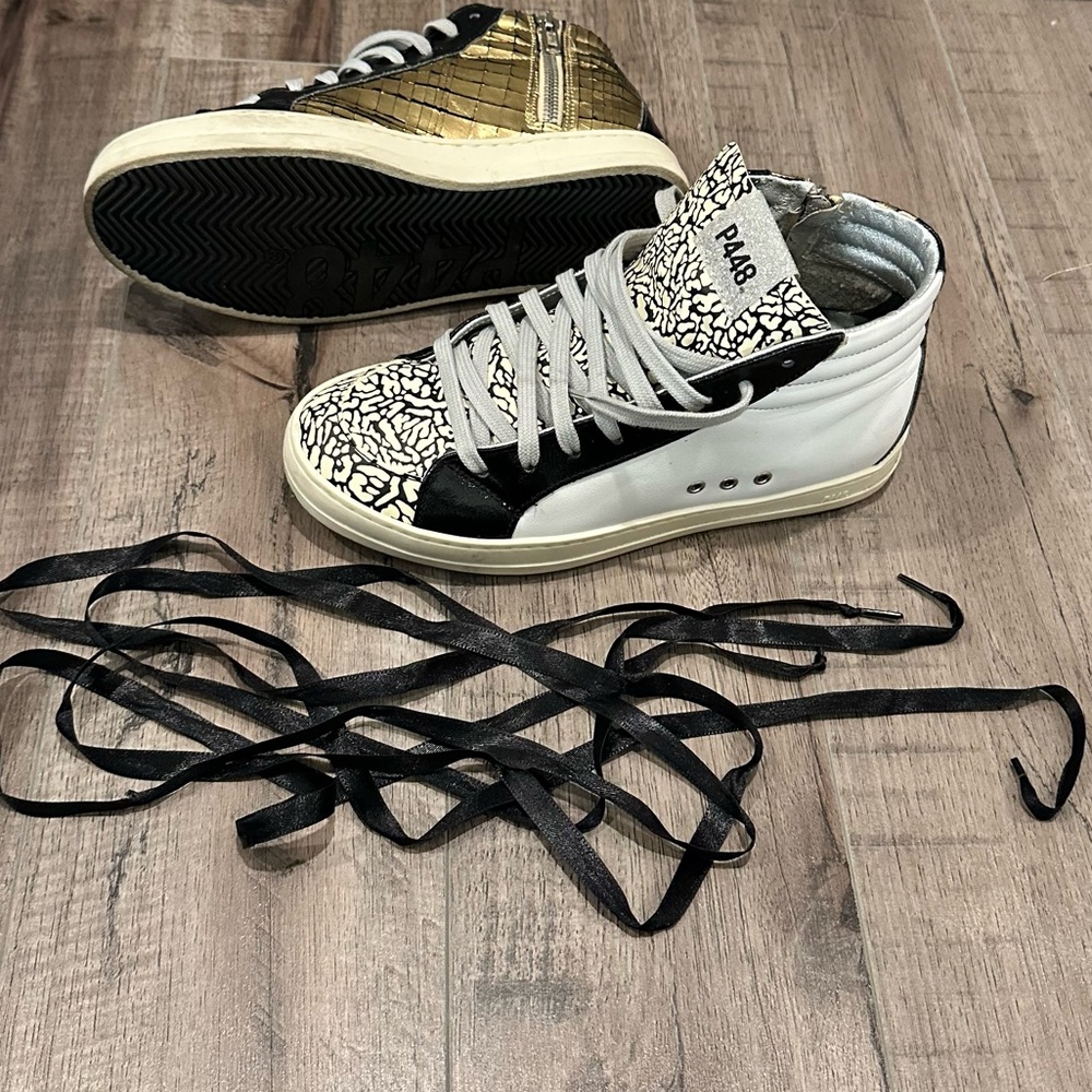 Black and White High-Top Sneakers with Gold Accent